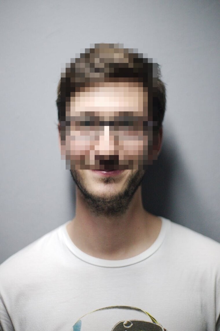 Portrait with the face pixelated into an unrecognizable mosaic