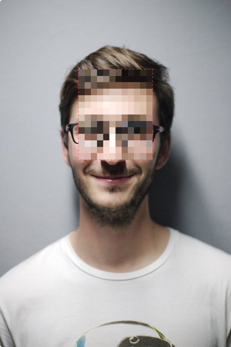 A portrait with a box dragged over the eyes and forehead, that region pixelated into an unrecognizable mosaic